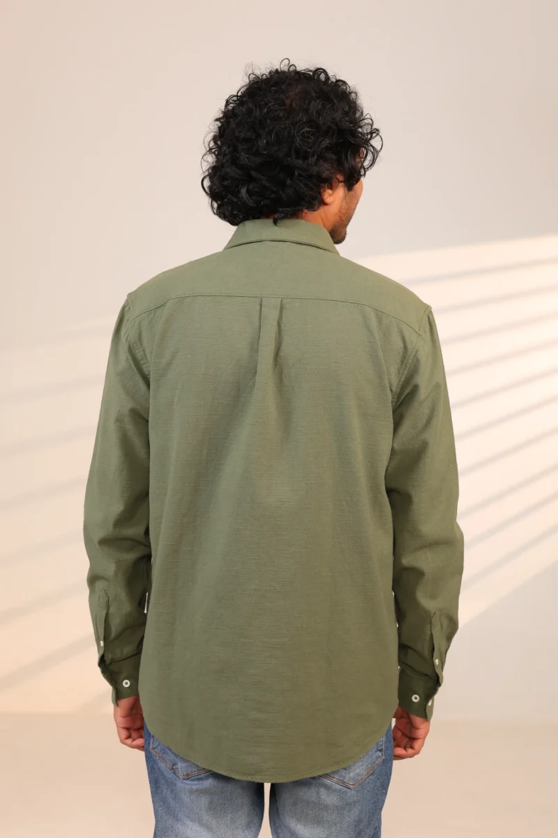 Rear view of olive green shirt with pleated back.